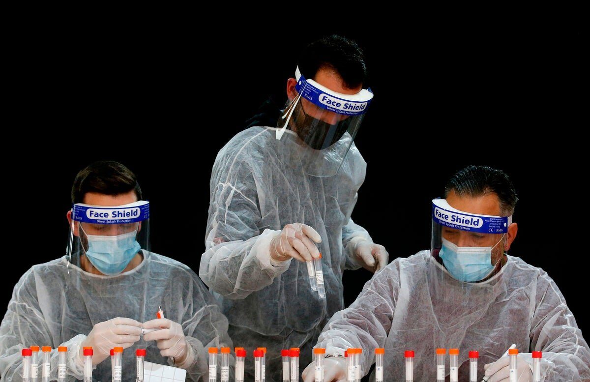 Click to enlarge lab workers