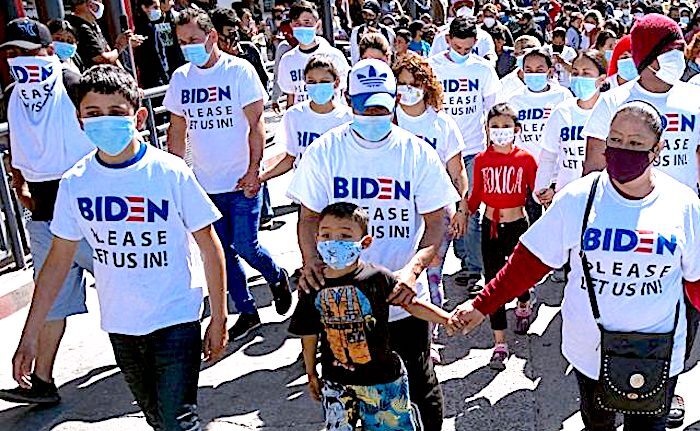 Click to enlarge migrant marchers