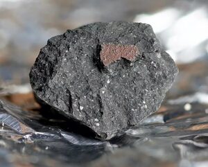 A chunk of the meteorite that was recovered from Winchcombe in England
