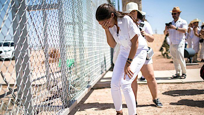 Click to enlarge woman at fence