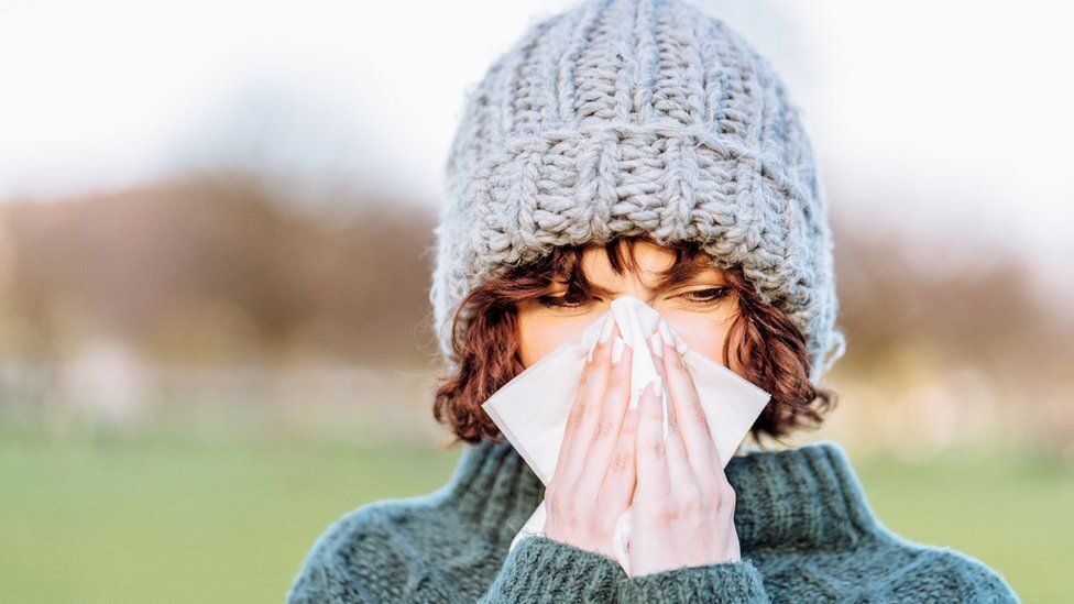 Common cold. Простуженный человек. Простуженный ветрами. Простуженный человек фото смотрит в окно.