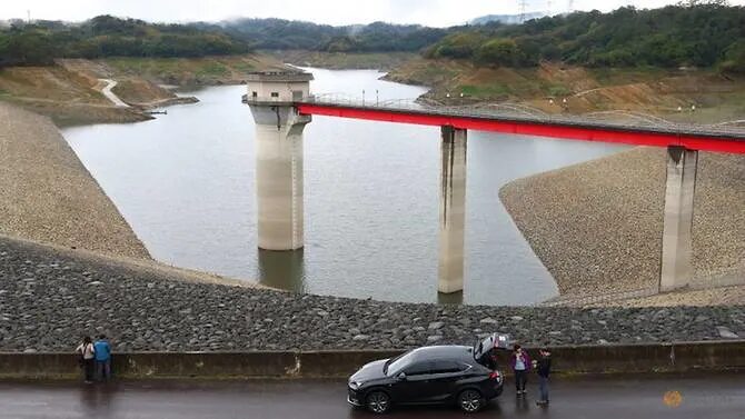 Tourists visit the Baoshan second reservoir amid low water levels during an islandwide drought, in Hsinchu, Taiwan