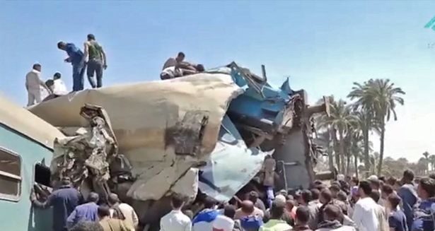 Click to enlarge Clips show people clambering over the wreckages