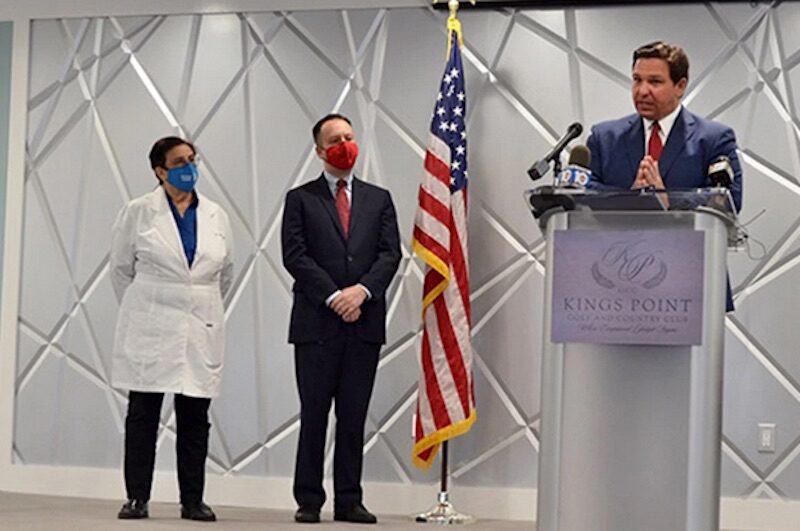 Click to enlarge Palm Beach County Mayor David Kerner, center, and Florida Gov. Ron DeSantis