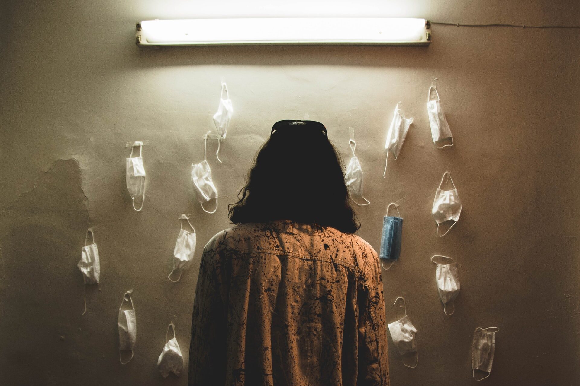 person in front of masks