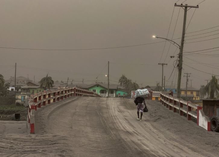 Click to enlarge Man walking in ash in St. Vincent.