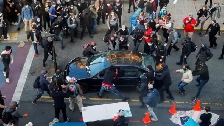 car surrounded protest