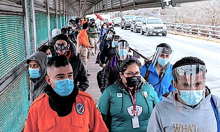 Click to enlarge Migrants bridge walk