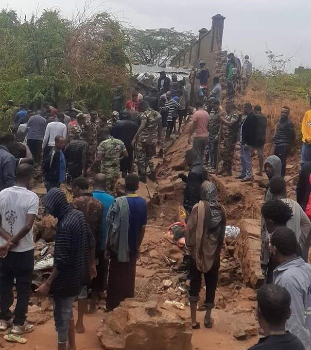 Click to enlarge Nine people were killed yesterday when a 50 meter concrete wall collapsed on residential houses following four hours nonstop heavy rain in Dire Dawa city.