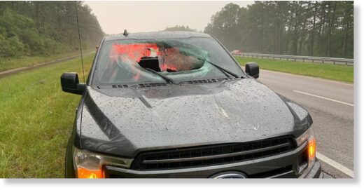 A lightning strike hit I-10 Monday morning, sending a piece of the road through a truck's windshield. Both occupants were injured.