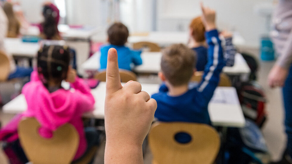 Click to enlarge school room raised hands
