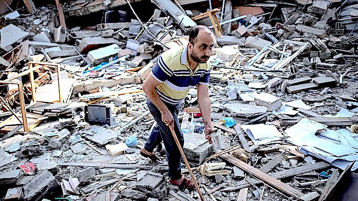 Click to enlarge Man in rubble