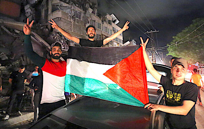 Palestinians and flag celebrate