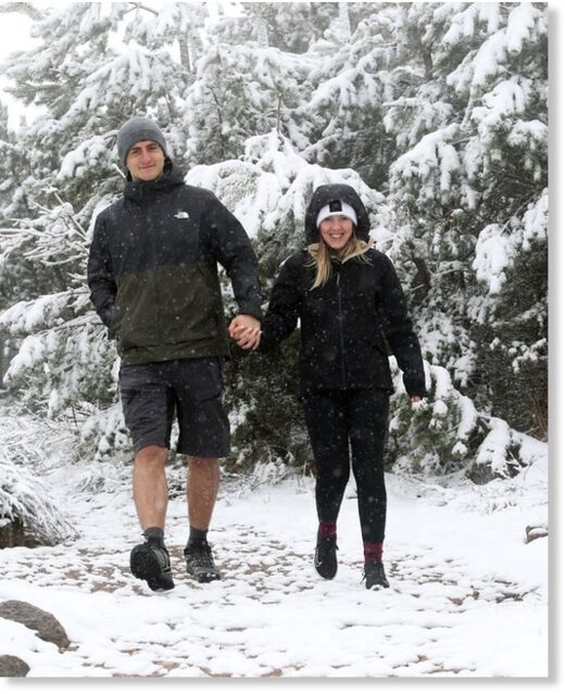 Srdjan Lulic and Catherine Stewart were surprised by yesterday's snowfall at Cairngorm National Park.