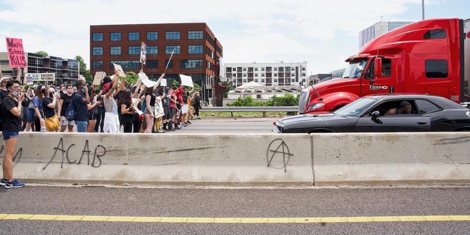 Protesters block street austin