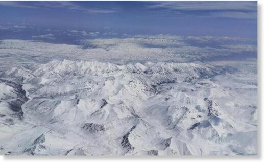 The photo captured on May 23, 2021 shows a snowfall on the Qilian Mountains,