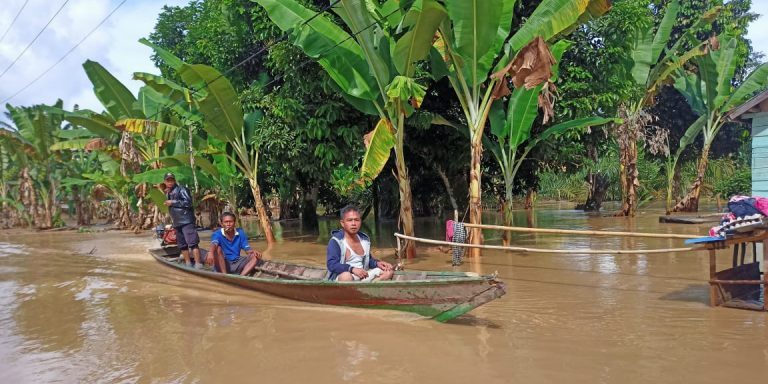 Flood evacuations by boat in Musi Rawas Regency, 27 May 2021.