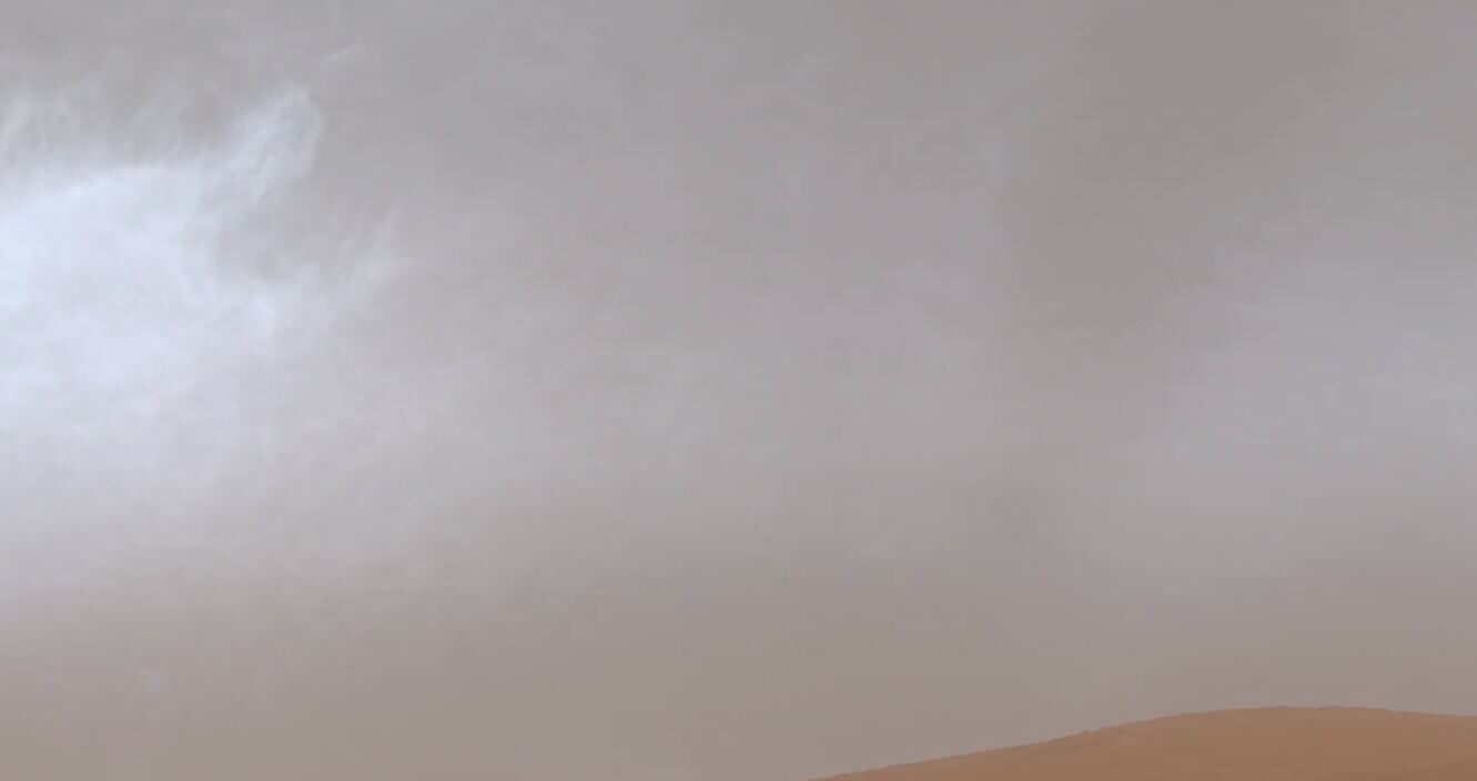 Clouds drift over Mount Sharp in the Gale Crater