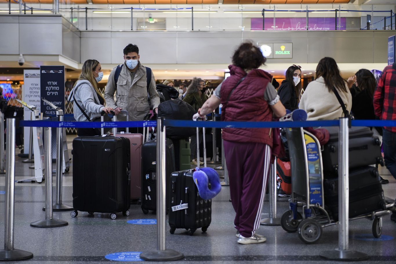 Click to enlarge Masked people in airport