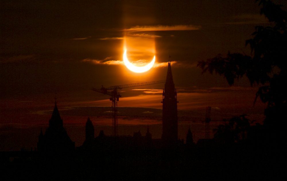 Stunning photos show solar eclipse as a 'ring of fire' over Canada and