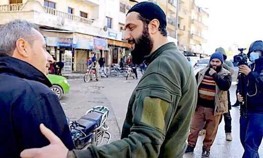 Click to enlarge Jolani greeting guy