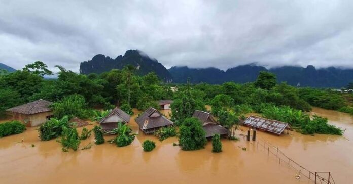 The Nam Song River bursts its banks in Vang Vieng.