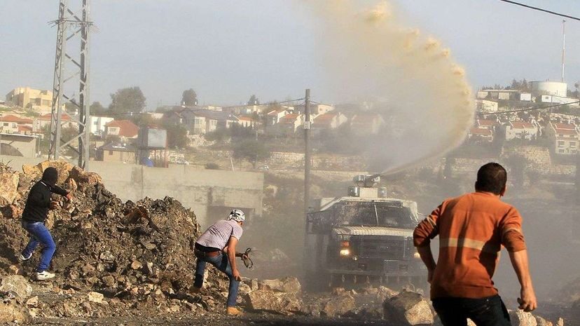 Click to enlarge skunk water crowd control israel palestinians