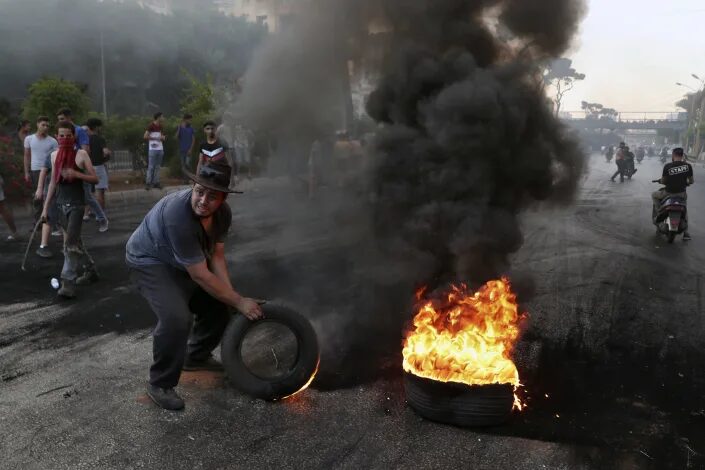 Click to enlarge protesters lebanon block road economy