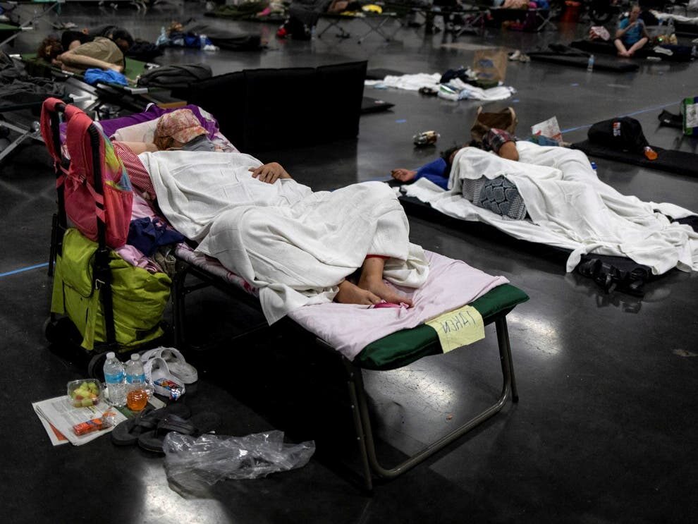 Click to enlarge People sleep at a cooling shelter set up during an unprecedented heat wave in Portland, Oregon