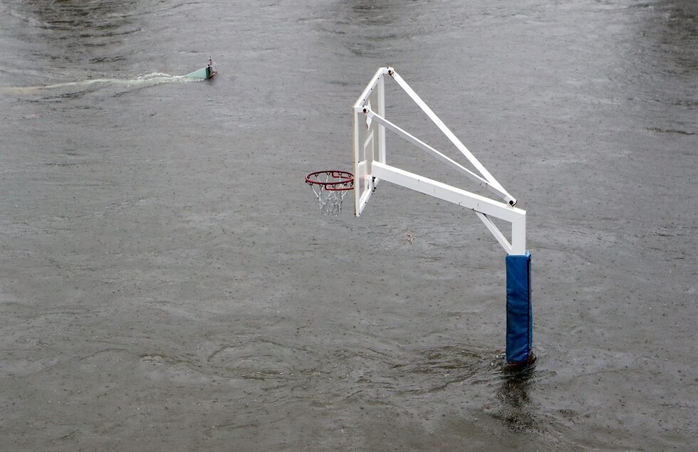 A basketball hoop stand is semi-submerged in floodwater at Busan Citizens Park, Busan, July 6.