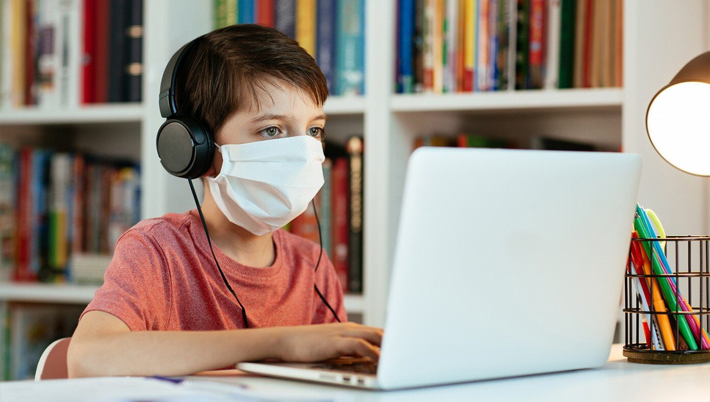 kid wearing mask