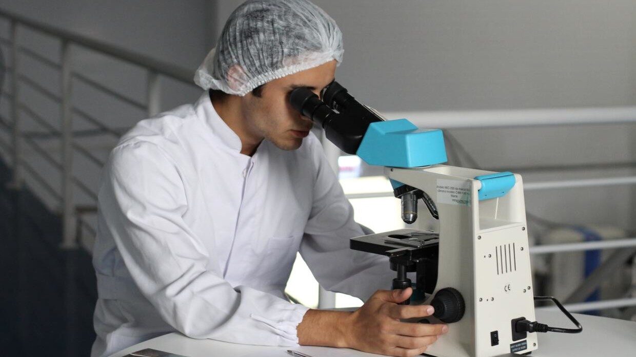 Click to enlarge scientist microscope