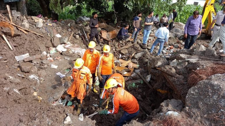 NDRF teams search for missing after floods in Himachal Pradesh, India, July 2021.