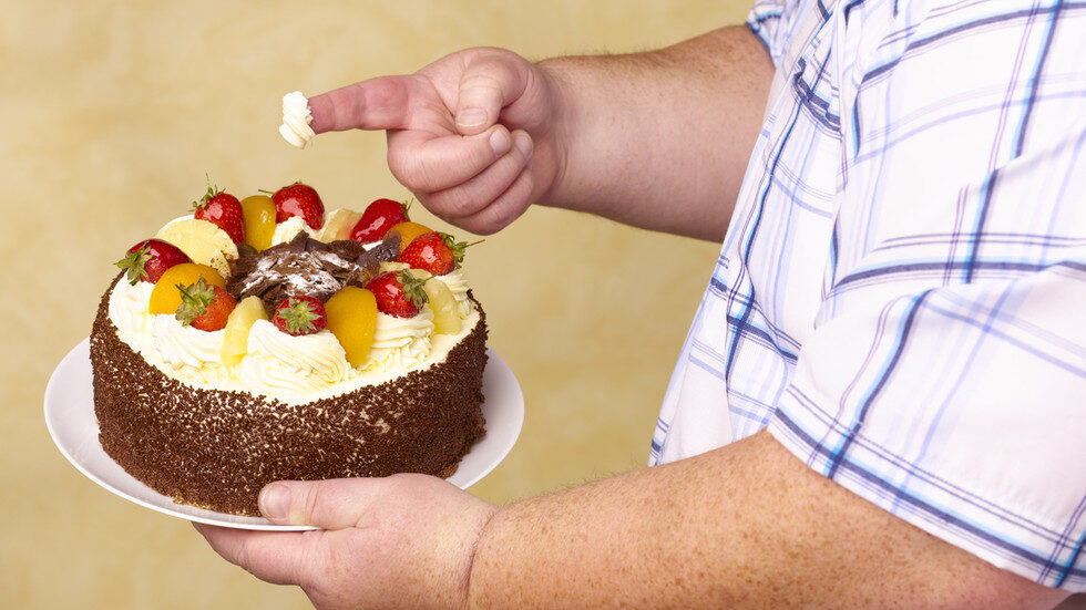 man eating cake