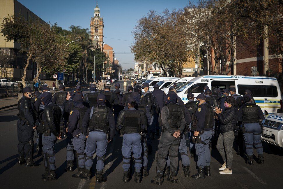 Click to enlarge South African police officers patrol