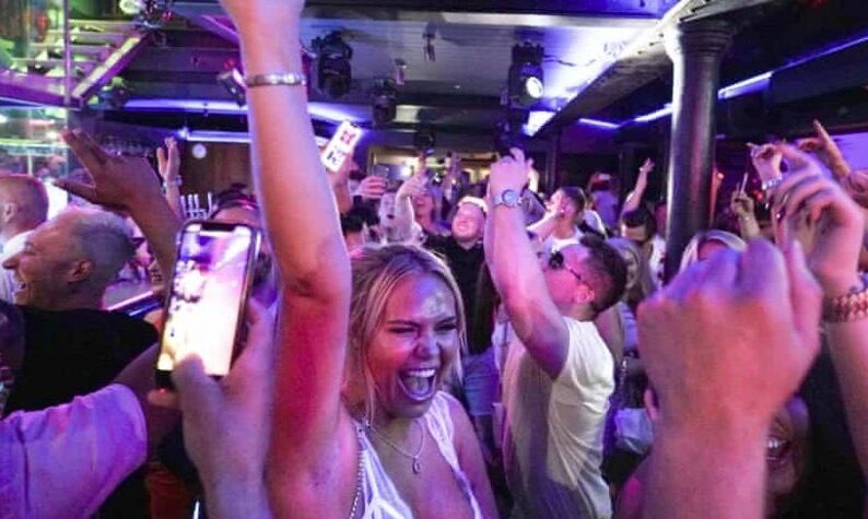 Click to enlarge People dancing at Bar Fibre in Leeds after England’s restrictions lifted on Monday.
