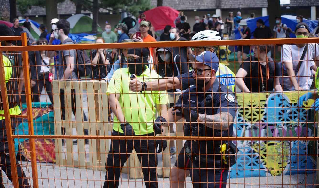 toronto police protesters homeless encampment