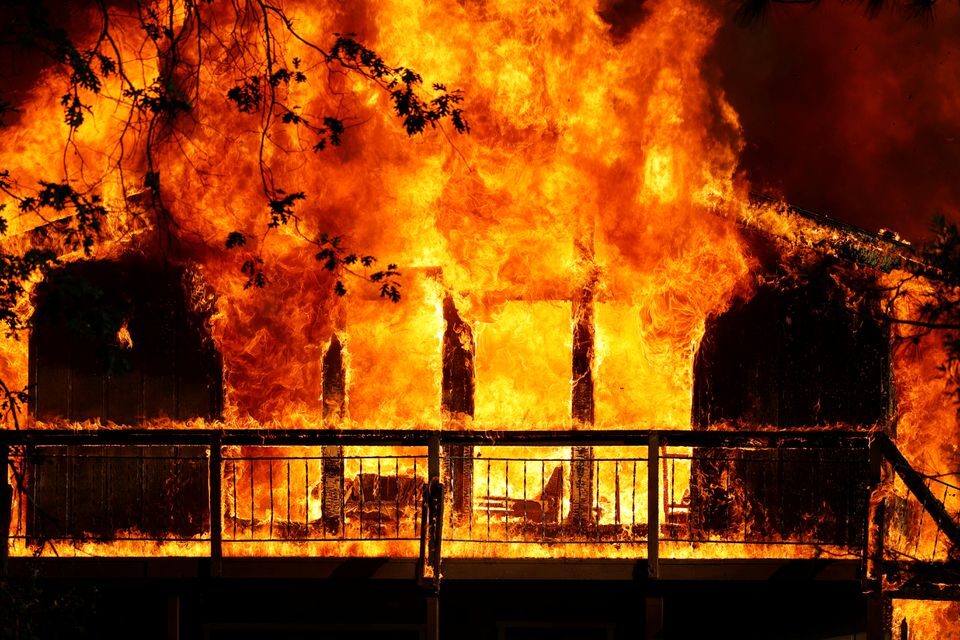 Click to enlarge A home is consumed by flames in the River F, a wildfire burning in Grass Valley, California, U.S., August 4, 2021. REUTERS/Fred Greaves