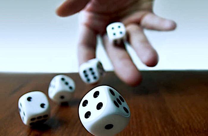 hand rolling dice