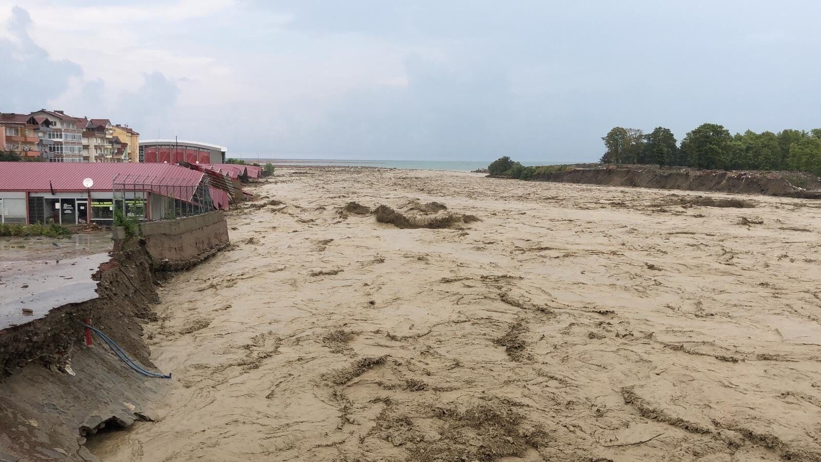 Click to enlarge View of roaring waters of a stream amid floods in Ayancık district, in Sinop, northern Turkey, Aug. 11, 2021.