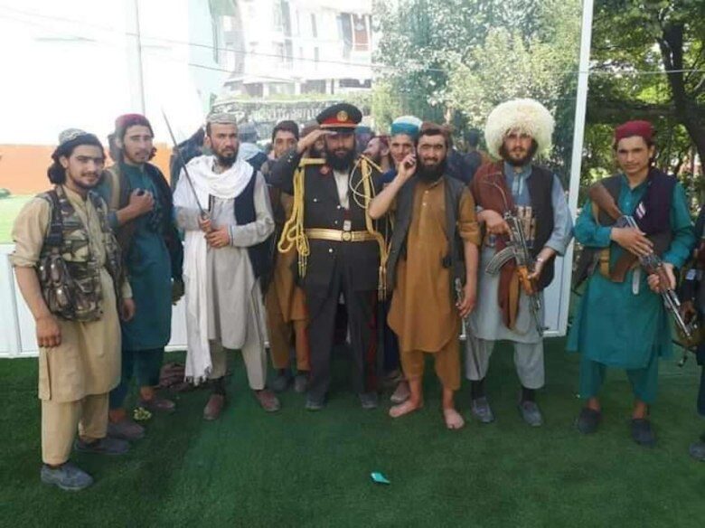Taliban posing with military garb