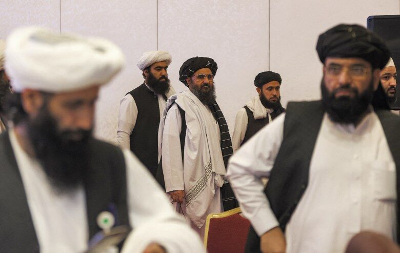 Mullah Abdul Ghani Baradar, center,