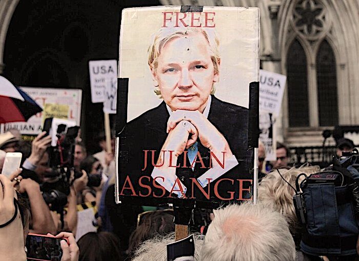 Assange sign crowd