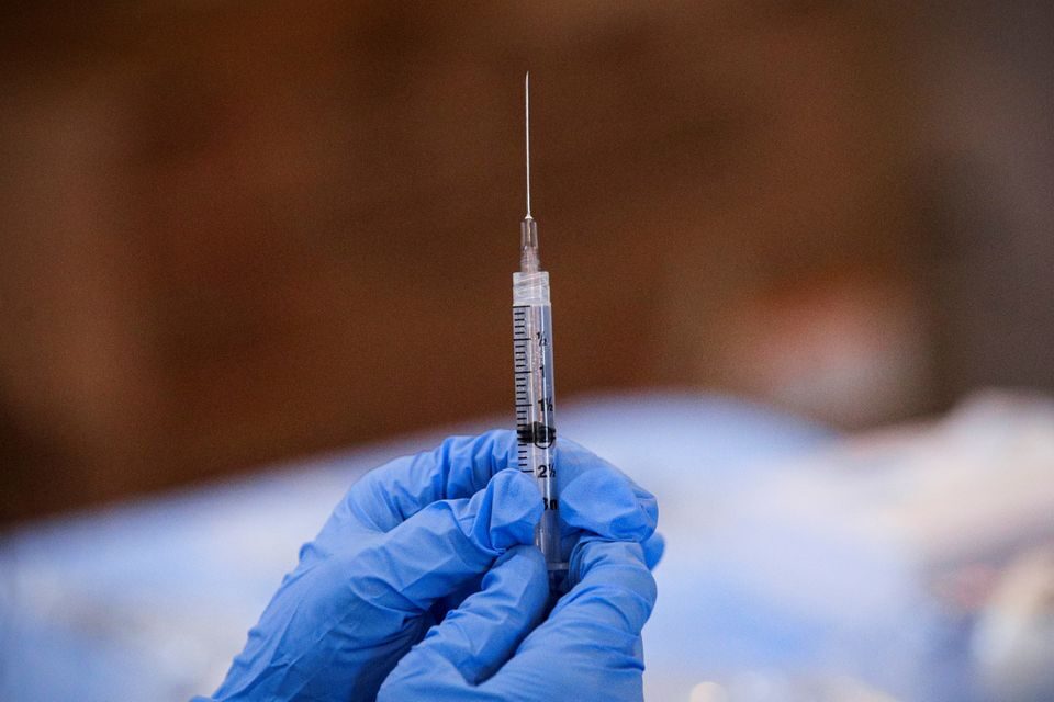 syringe covid vaccine shot