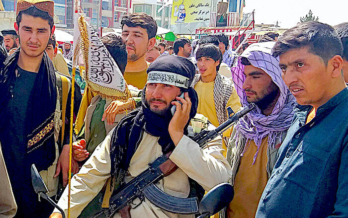 taliban guy on phone