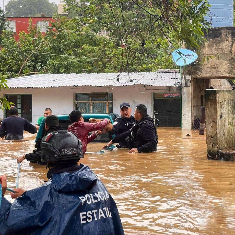 Flood rescue in Veracruz, Mexico after heavy rain from Hurricane Grace, 21 August 2021.