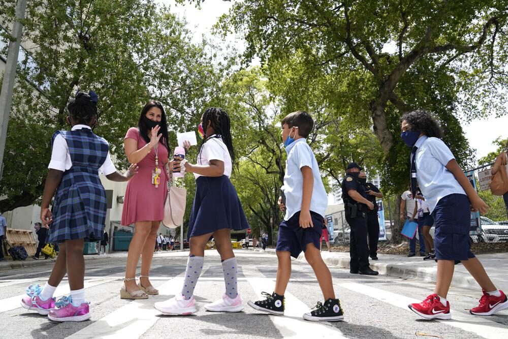 Click to enlarge Teacher Vanessa Rosario greets students outside of iPrep Academy