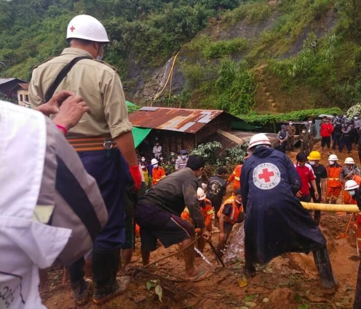 Search and rescue teams working at the scene of the landslide in Mogok Township, Myanmar, August 2021.