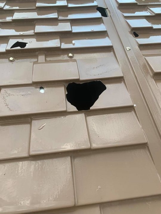 Click to enlarge Hail damage on a shed roof in Assiniboia.