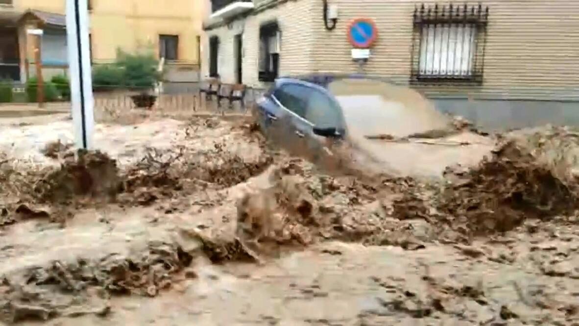 Street turns into river as flash floods wreak